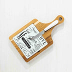 Gather 3 Piece Ceramic & Acacia Set Square featuring a natural acacia wood serving board with a black and white ceramic insert and coordinating cheese knife.