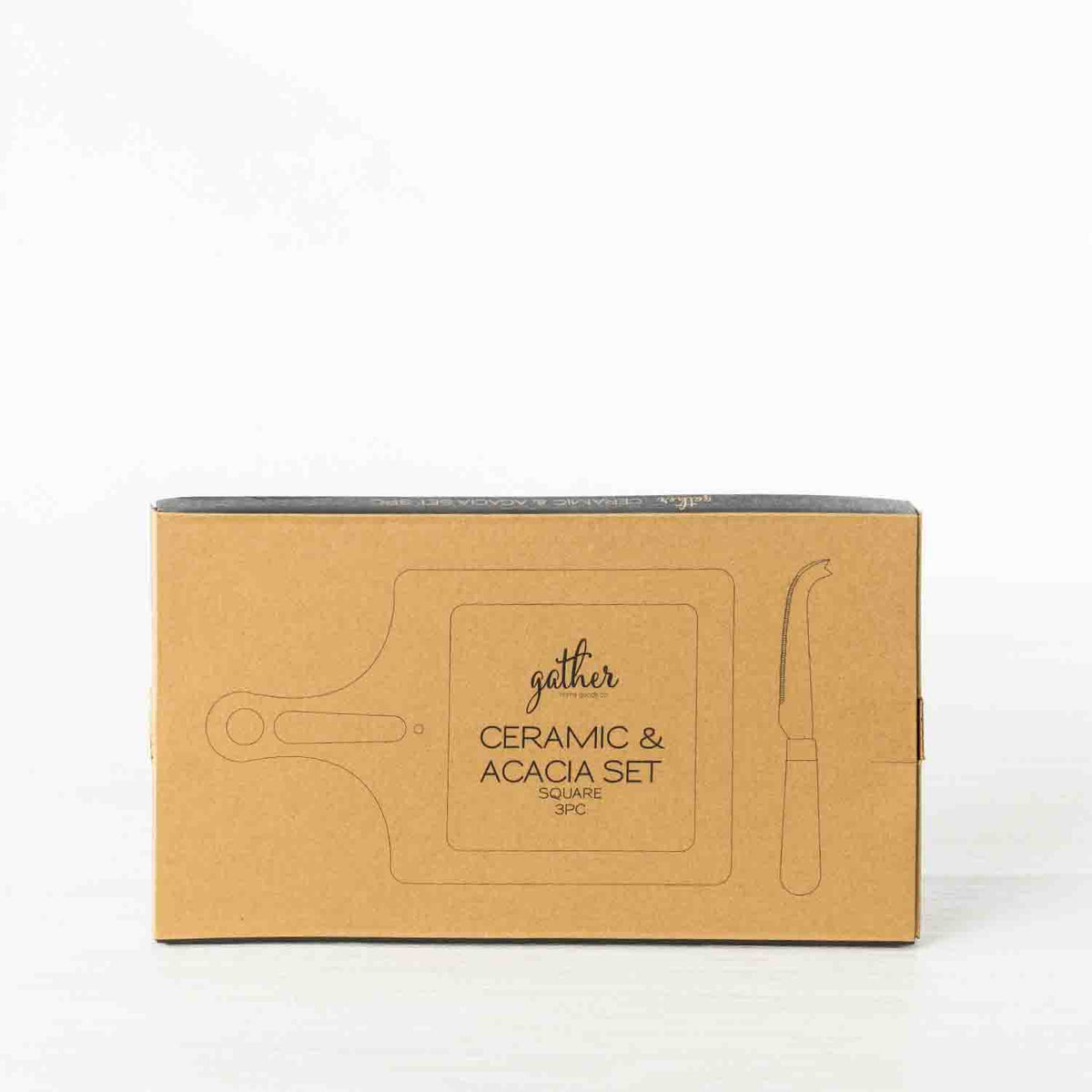 Gather 3 Piece Ceramic & Acacia Set Square presented in kraft cardboard packaging with illustrations of the square serving board, ceramic insert and cheese knife.