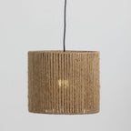 A cylindrical pendant lamp shade made of tightly wrapped natural jute rope, suspended from a black cord against a light gray background.