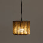 A cylindrical light shade wrapped in natural rope, suspended by a black cord against a plain dark gray background.