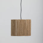 A light shade made from tightly wrapped natural jute rope, suspended from a black cord against a plain light gray background.