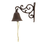 A decorative dark metal bell with a rope pull hangs from an ornate scrollwork wall bracket, shown against a plain light background.