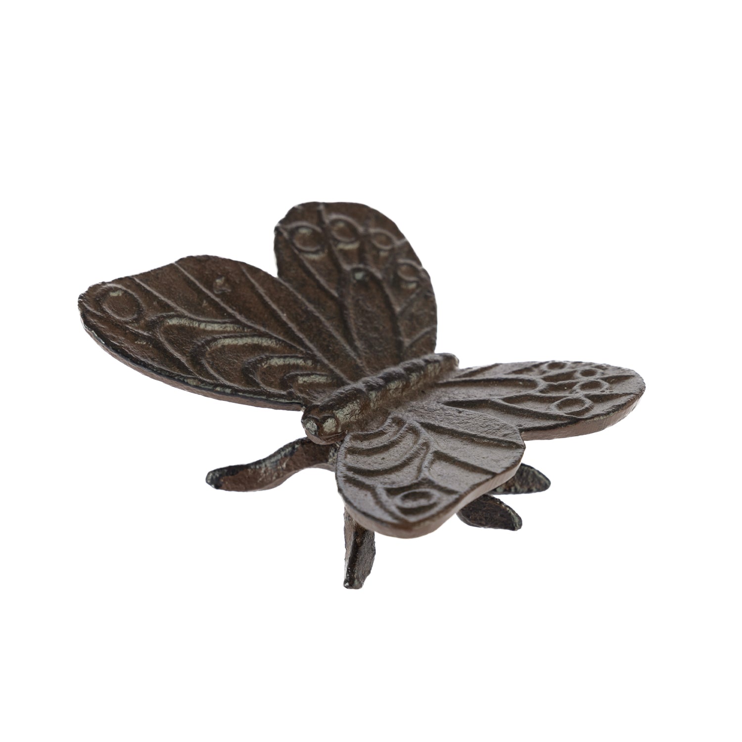 A decorative dark metal butterfly ornament with intricately patterned wings and small legs is shown against a plain light background.