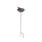 A decorative metal garden stake with a scalloped flower bowl, perched bird accent, and ground prongs is shown isolated against a plain light background.
