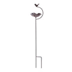 A decorative metal garden stake featuring a flower-shaped dish and a small perched bird on a curved arm is shown against a plain light background.