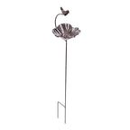 A decorative metal garden stake featuring a flower-shaped dish and a small perched bird on a curved arm is shown against a plain light background.
