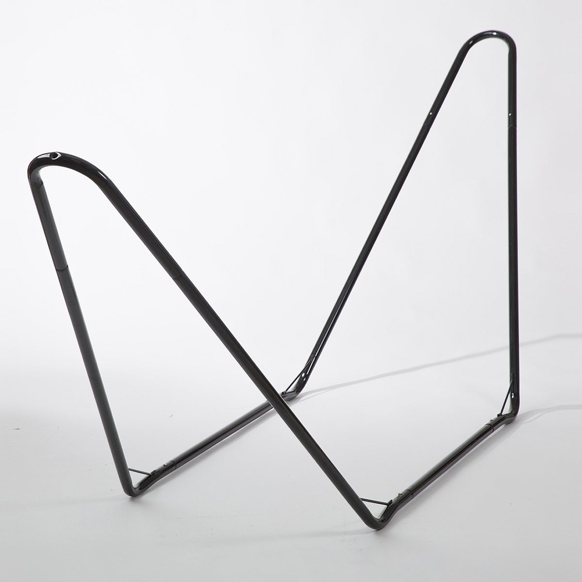 Black metal bookend on a white background