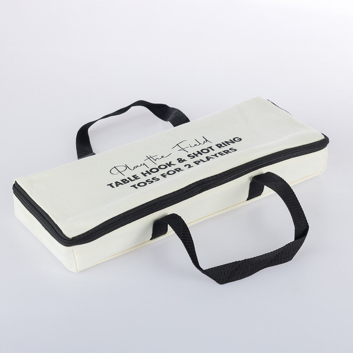 Play The Field table hook and shot ring toss game packed in a white carry case with black handles and zip closure.