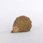 Outsidings Walter Garden Hedgehog in natural, shown from the side with a carved timber-look finish and floral textured spines.