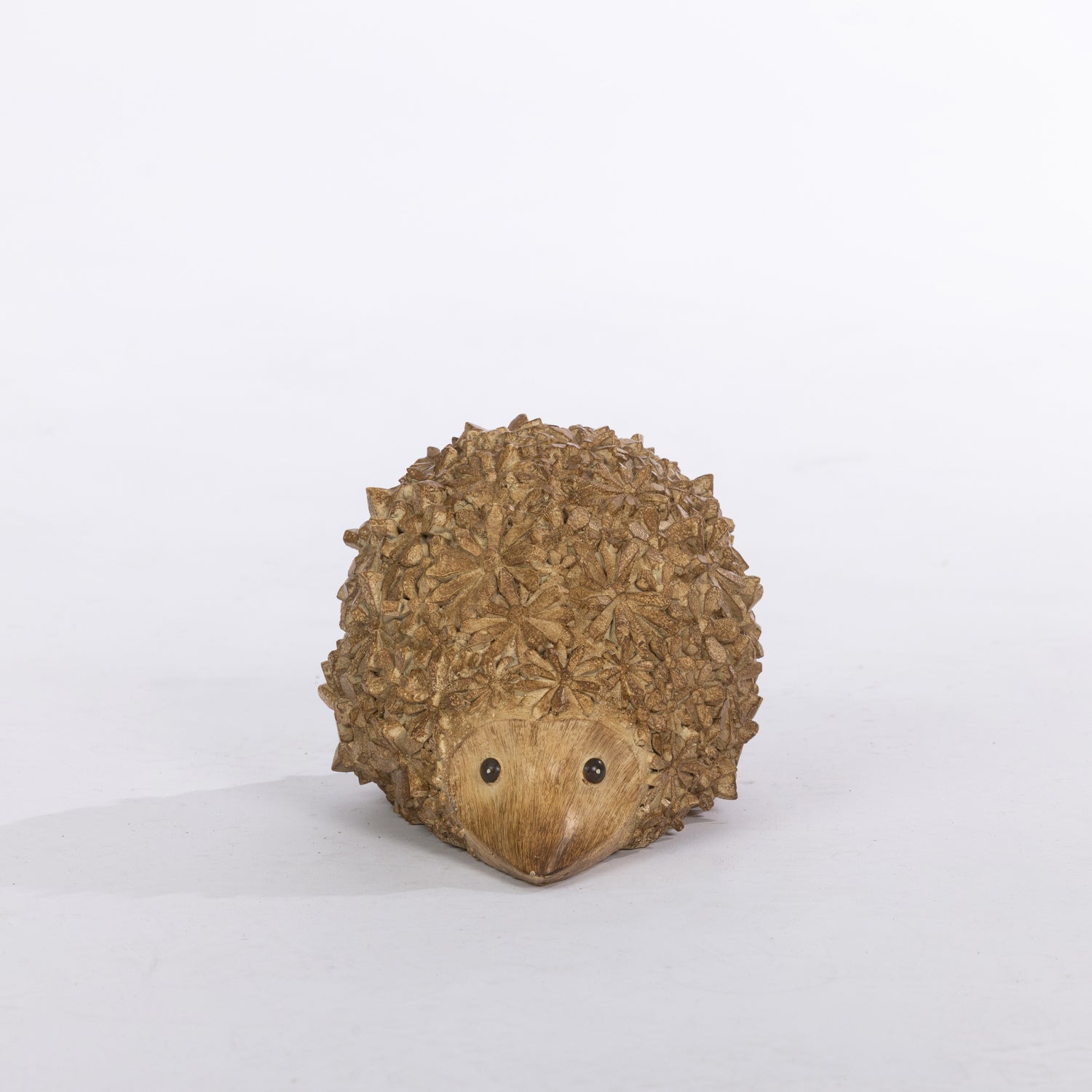 Outsidings Walter Garden Hedgehog in natural, shown from the front with a rounded floral-textured body and sweet woodland design.