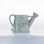 Outsidings Brynn Watering Jug Planter, featuring a vintage-inspired watering can shape with a distressed grey finish and embossed floral detailing.