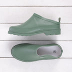 Green haze low-cut waterproof garden shoe shown from the side and top, featuring a slip-on design, rear pull tab and chunky treaded sole.