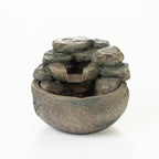 Rock-effect LED water fountain with stacked stone design, shown on a white background.