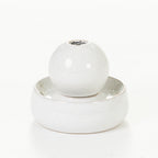 White porcelain ball LED fountain with a matching round base, shown on a white background.