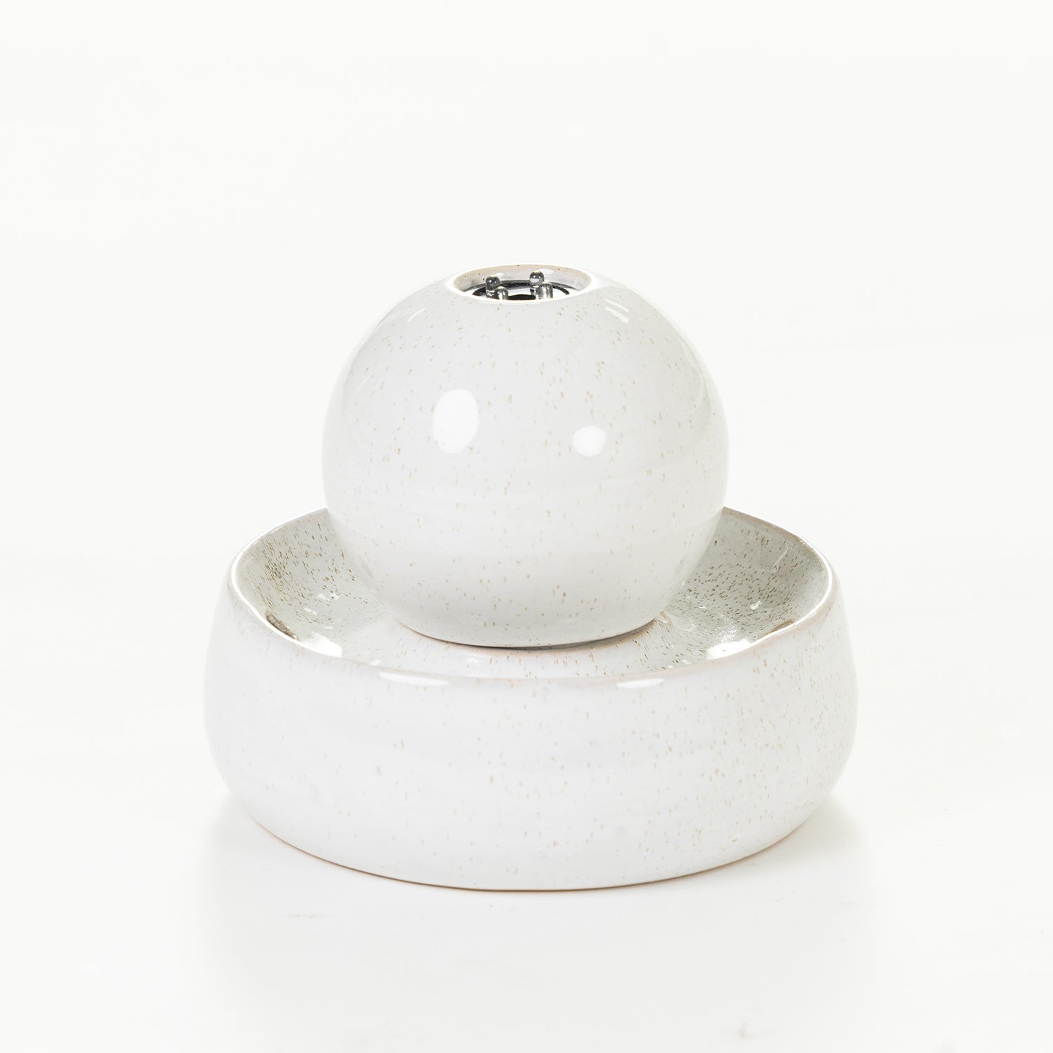 White porcelain ball LED fountain with a matching round base, shown on a white background.
