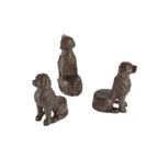 Three small brown dog-shaped decorative pot supports are shown from different angles against a plain light background.