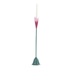 Pink and green metal stem candle holder with a white taper candle.