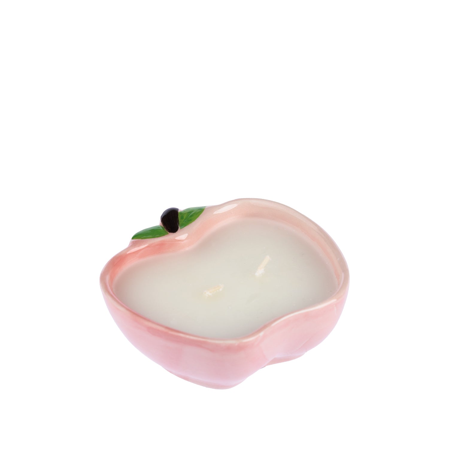 Outsidings Sultry Citronella Candle in Apple Pink, featuring a soft pink apple-shaped ceramic vessel with green leaf and stem detailing and white wax.