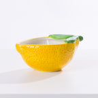 A citronella candle in a lemon holder