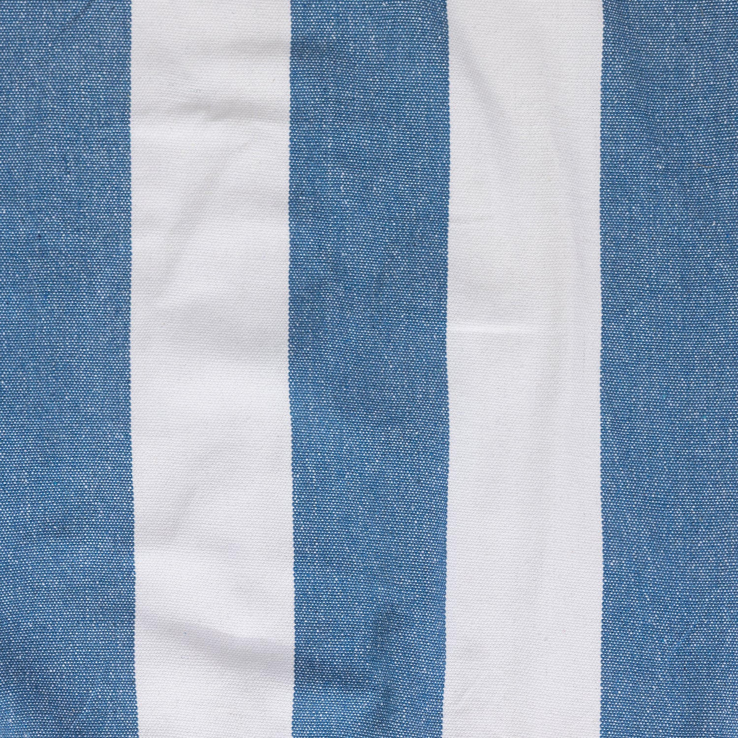 Close-up of the blue and white striped hammock fabric showing the woven texture.