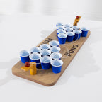 Play the Field Mini Pong wooden tabletop game with blue cups, ball launchers and tethered red balls.