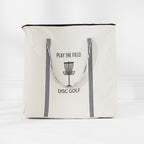 Cream Play the Field Disc Golf storage bag with black striped handles and printed disc golf design.