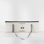Play The Field Tetherball Game packed inside a cream canvas zip bag with black striped handles.