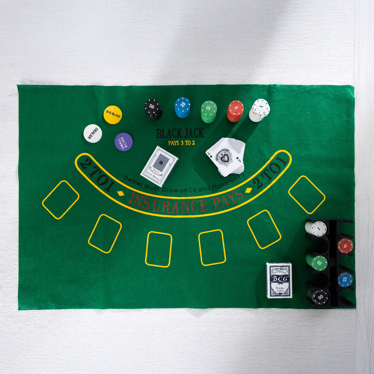 Overhead view of the Play the Field Texas Card Set featuring a green blackjack mat, colourful poker chips, playing cards and chip rack.