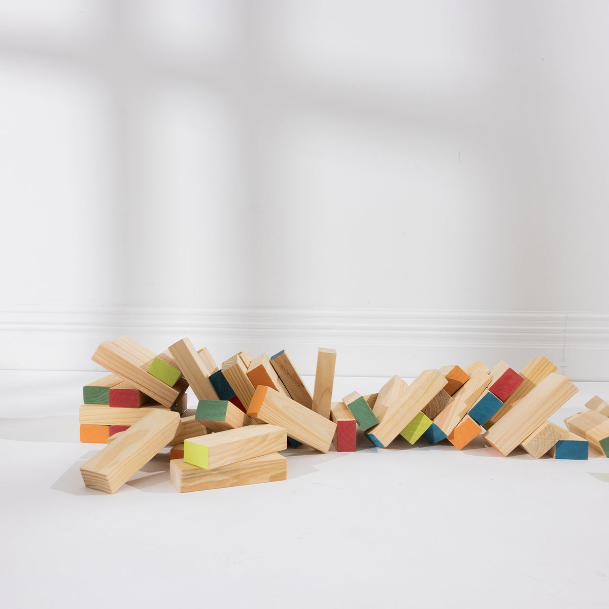 Play the Field Tumble Tower cream storage bag with black striped handles and printed tower design.