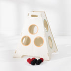 Play the Field Tower Ball wooden target tower with coloured throwing holes and red and black balls displayed in front.