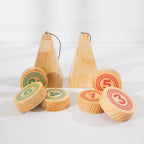 Two wooden Roll On game targets with numbered red and green wooden discs arranged in front.