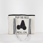 Play The Field Roll On Game packed inside a cream canvas zip bag with black striped handles.