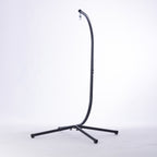 Black swing chair stand with a curved hanging frame, suspension hook and four-leg cross base.