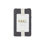 A beautifully packaged 1000 thread count cotton body pillowcase is presented with a reusable branded storage band and elegant sleeve, reflecting timeless luxury and thoughtful design.