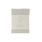 Folded linen pillowcase with packaging on a white background