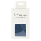 A white retail package labeled “hometones Pillowcase Pair 73 × 47 cm” features a window displaying a blue fabric sample against a plain light background.