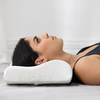 Side profile of person resting on Aloe Vera contour memory foam pillow demonstrating neck alignment support.