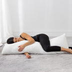 Person resting on an Aloe Vera body pillow, demonstrating full-body support for side sleeping.
