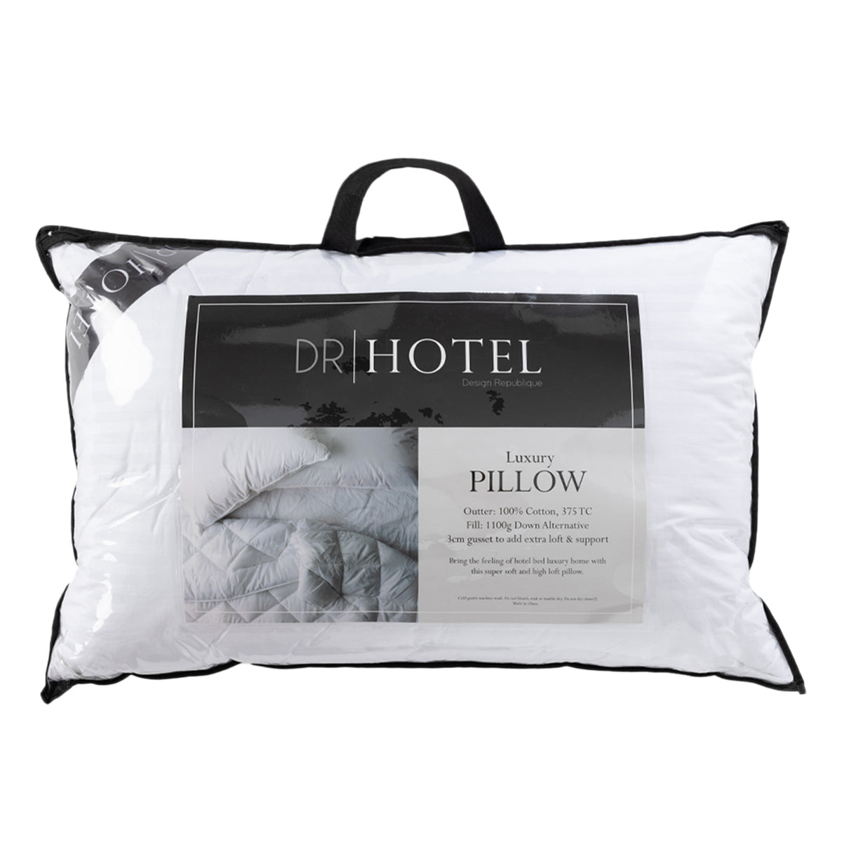 Design Republique Hotel Luxury Pillow in white, presented in its clear carry bag packaging with black trim and handles.