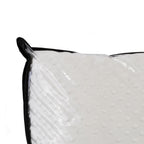 Close-up of the Eden Bobble Pillow showing the plush white bobble-textured fabric through the clear zippered carry bag.
