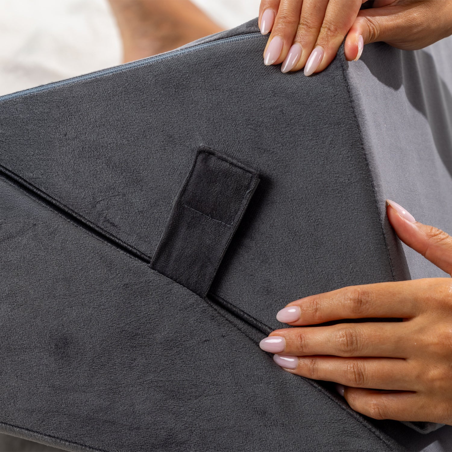 Close-up of the fastening strap secured in place on the Solace Multi-Purpose Wedge Support Pillow.