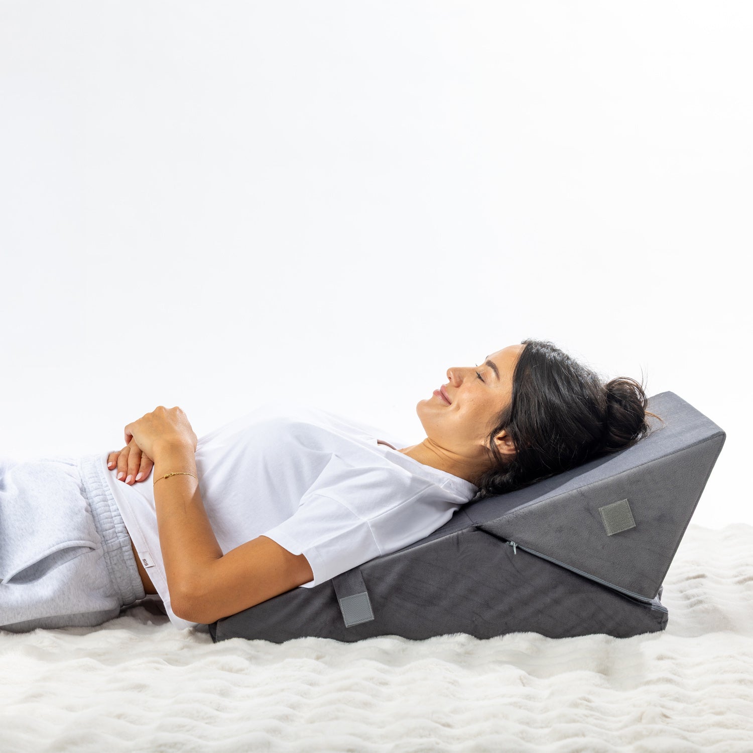 Solace Multi-Purpose Wedge Support Pillow configured into an angled backrest for comfortable reclining.