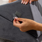 Close-up of the hook-and-loop fastening tabs on the grey Solace Multi-Purpose Wedge Support Pillow.
