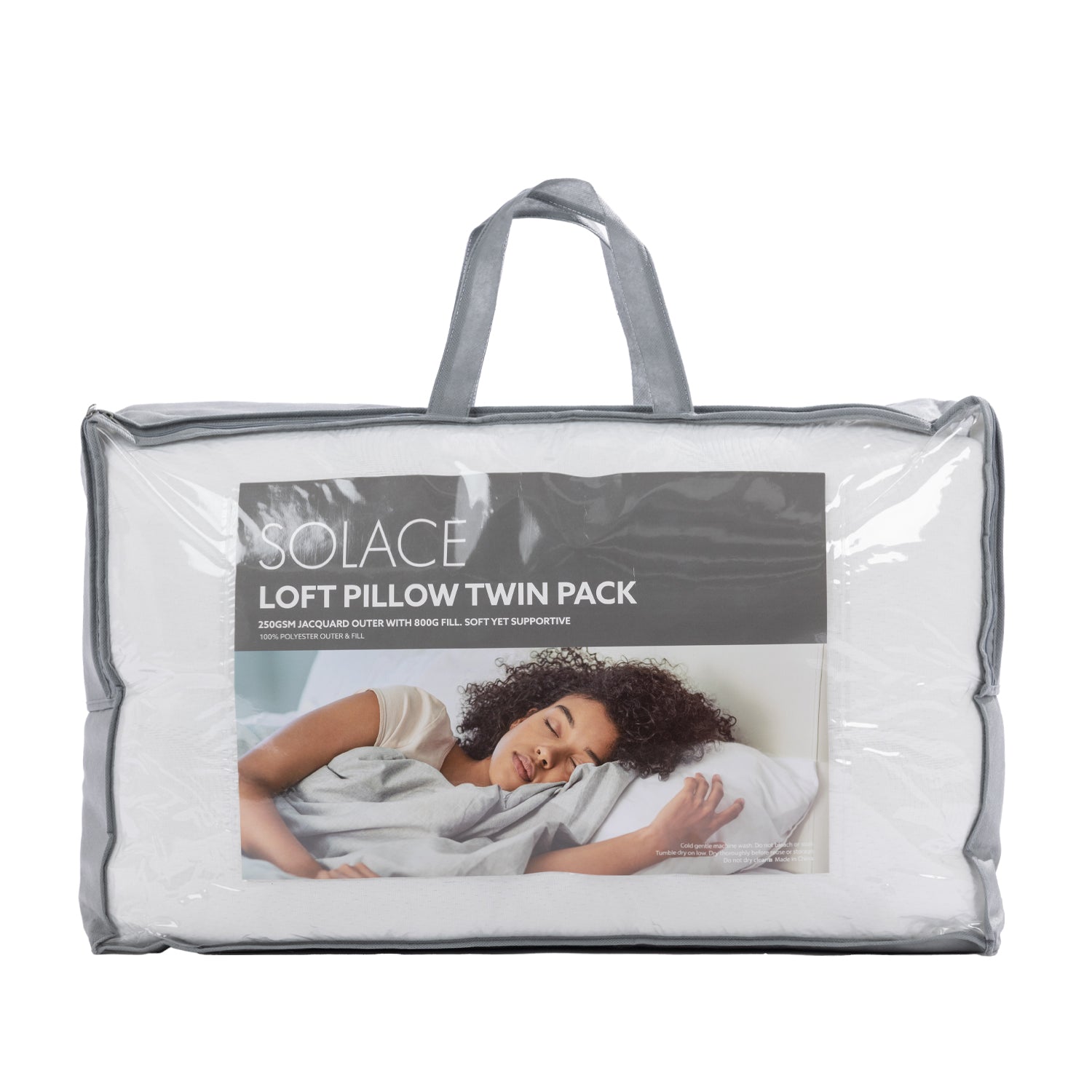 Solace Loft Pillow Twin Pack in a clear plastic storage bag with gray handles and a gray label showing a woman sleeping comfortably.