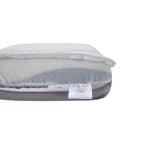 White dual side memory foam pillow with removable cover opened to reveal the inner foam and firm support label.