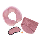 Blush travel pillow kit with memory foam neck pillow, eye mask, earplugs and storage bag displayed on a white background.