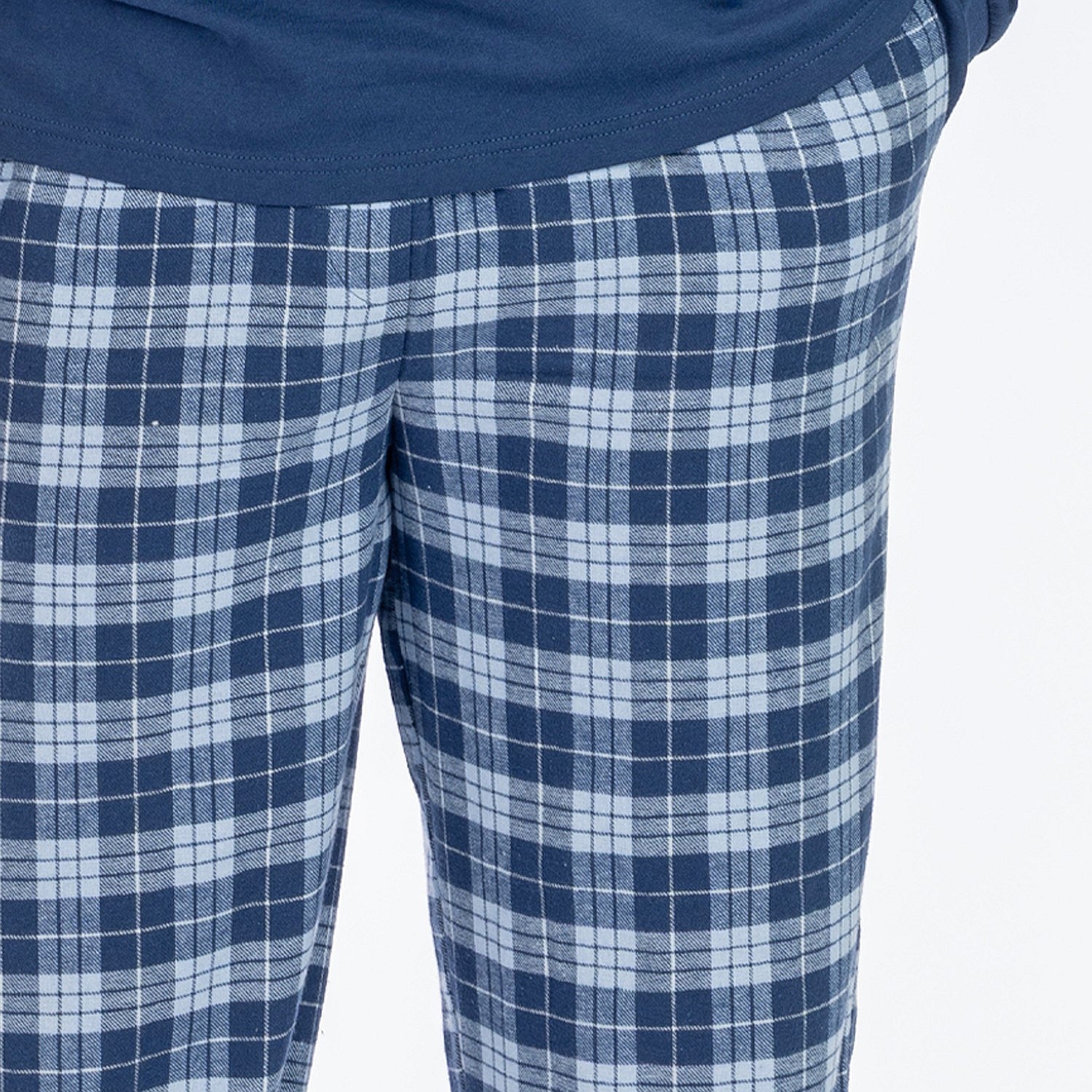Man wearing blue check flannelette pyjama pants.