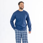 Man wearing a blue long sleeve top with blue check flannelette pyjama pants.