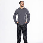 Man wearing a dark grey long sleeve top with black check flannelette pyjama pants.