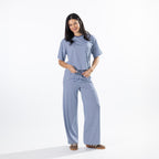 Woman wearing the Simple & Sunday Lounge Relaxed Stripe Tee in Faded Blue with matching lounge pants, full-length view.
